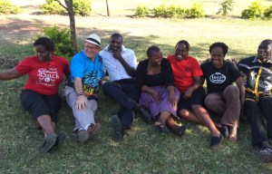 Team leader John Guest relaxes with new friends